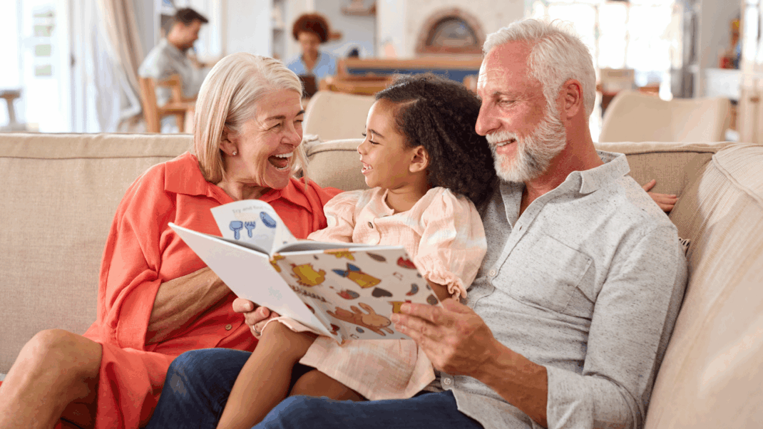 toddler with grandparents at school